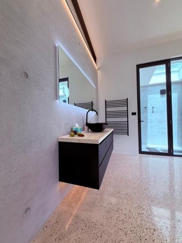 a kitchen with a counter and a large window at Huzzah! in Theresa Park