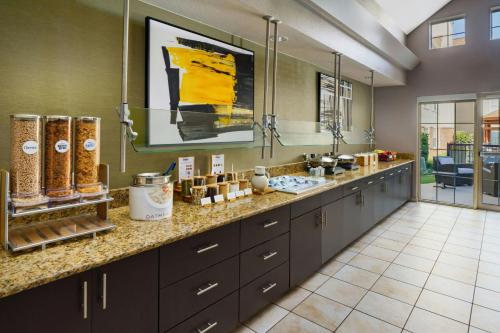 a large kitchen with a large counter top with a counter top at Residence Inn Arlington in Arlington