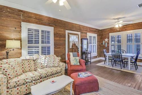 a living room with a couch and a table at Walk to the Beach! in Gulfport