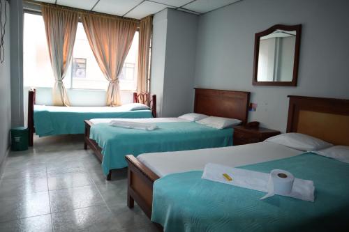 Postel nebo postele na pokoji v ubytování Hotel casa real