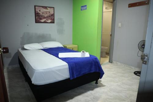 Postel nebo postele na pokoji v ubytování Hotel casa real