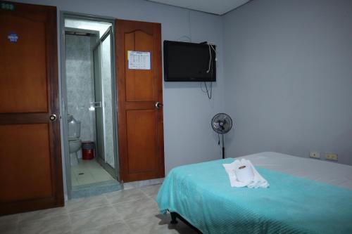 Postel nebo postele na pokoji v ubytování Hotel casa real