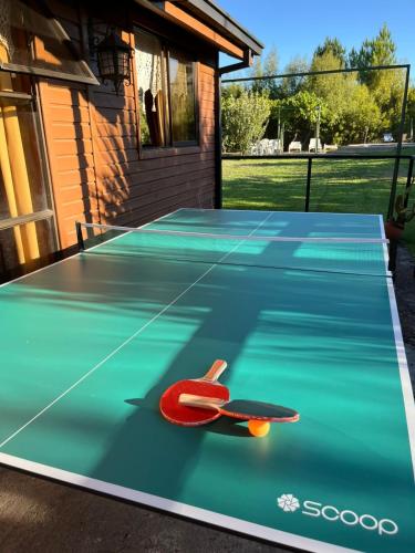 a ping pong table with a skateboard on it at Parcela Paulita in Quillón