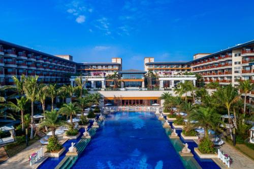 an aerial view of a resort with a swimming pool at Wyndham Grand Plaza Royale Wenchang in Wenchang