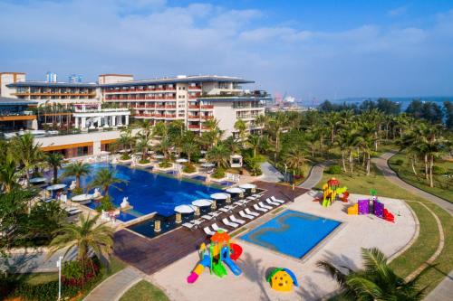 an aerial view of a resort with a swimming pool at Wyndham Grand Plaza Royale Wenchang in Wenchang
