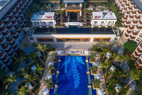 an aerial view of a resort with a swimming pool at Wyndham Grand Plaza Royale Wenchang in Wenchang