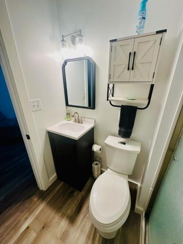 a small bathroom with a toilet and a sink at The whole family in Sunrise Beach