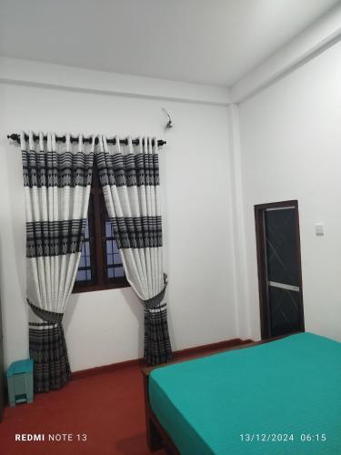 Katil atau katil-katil dalam bilik di Wilpattu Gagana guest