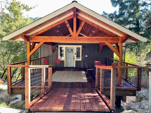 a wooden deck with a pavilion on it at Avenue of the Giants Pepperwood Place (#2) in Miranda