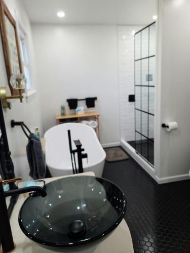 a bathroom with a sink and a toilet at Gatliff Getaway in Warsaw
