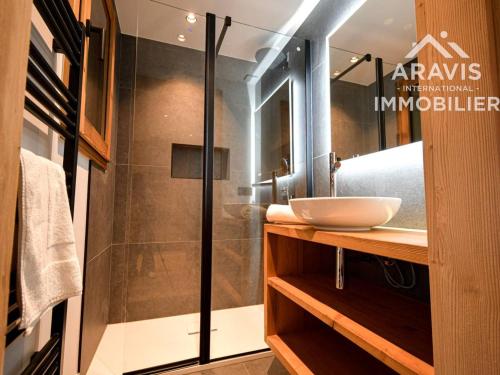 a bathroom with a sink and a shower at Chalet au Grand Bornand – 6 Chambres Spacieuses & Ambiance Chaleureuse - FR-1-391-194 in Le Grand-Bornand
