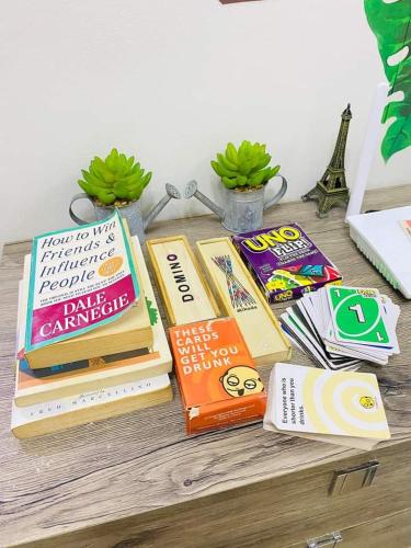 a pile of books sitting on a table at 1BR at Trees Residences with Balcony in Quezon City