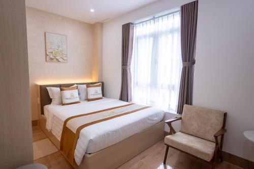 Una cama o camas en una habitación de Sunshine Homestay Bạc Liêu