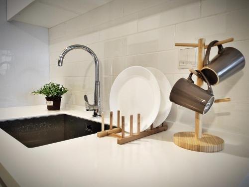 a kitchen counter with a sink and a sink at Luxury Sky Pool 8-Pax City Centre Beacon in George Town