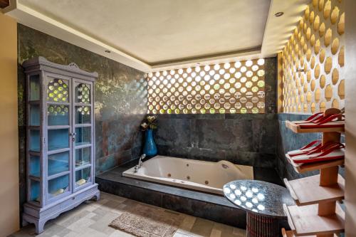 a bathroom with a bath tub in a room at Ocean Pearl Seaview Residence in Rawai Beach
