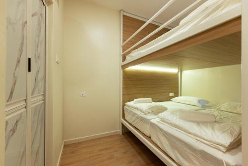 Postel nebo postele na pokoji v ubytování Dreambox Malacca