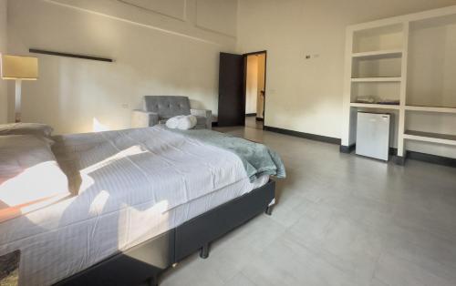 a bedroom with a large bed in a room at La Gran Reserva in Los Santos