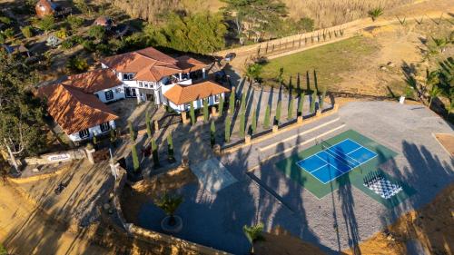 an overhead view of a house with a pool and trees at La Gran Reserva in Los Santos