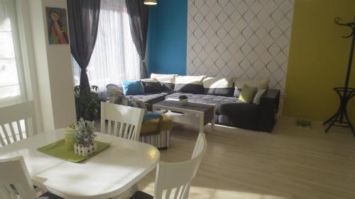 a living room with a couch and a table at Apartment Sophie in Plovdiv