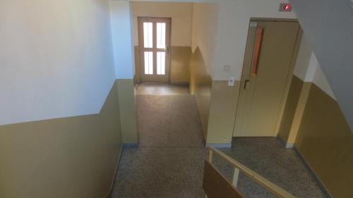an empty room with a staircase and a door at Apartment Sophie in Plovdiv