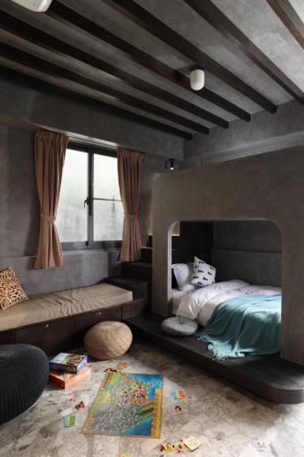a bedroom with a bed and a large window at Rolling hills in Puli