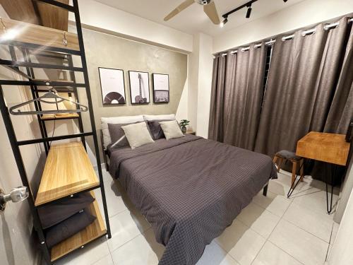 a bedroom with a bunk bed and a ladder at Cozy! 1-6 Pax, Bandar Sunway Subang Mall, Free 1cp in Subang Jaya