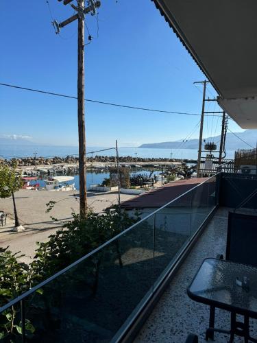 a balcony with a view of a marina at Artemis Apartments in Diakopto