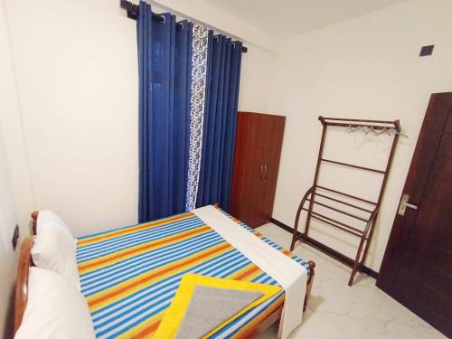 Ένα ή περισσότερα κρεβάτια σε δωμάτιο στο Vinu Home Stay