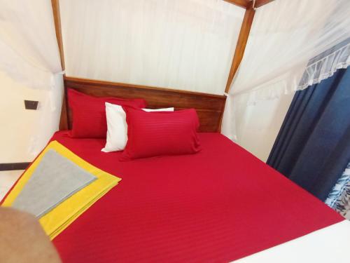 Ένα ή περισσότερα κρεβάτια σε δωμάτιο στο Vinu Home Stay