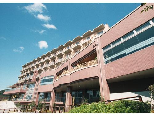 a large building with balconies on the side of it at Kaikyo View SHIMONOSEKI - Vacation STAY 13684v in Shimonoseki