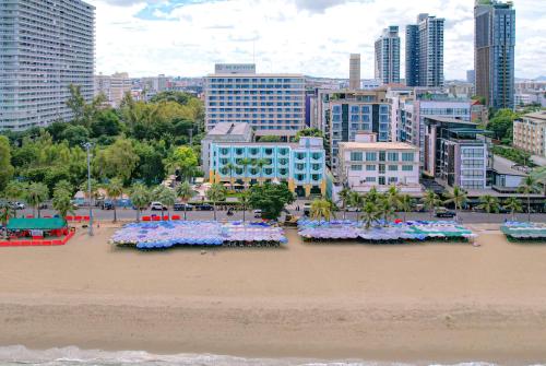 a view of a beach with flowers in the sand at Wave Hotel Pattaya in Pattaya Central