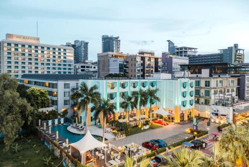 an aerial view of a city with buildings and a pool at Wave Hotel Pattaya in Pattaya