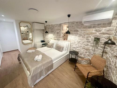 Ένα ή περισσότερα κρεβάτια σε δωμάτιο στο Mediteran dream studios