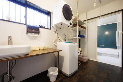 a hospital room with a sink and a sink at blue moon blue in Ito