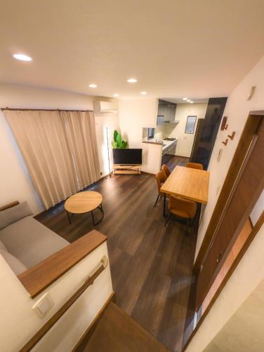 a living room with a table and a kitchen at japan house ヴィラ貸切東向島駅5分スカイツリー近く三号館 in Tokyo