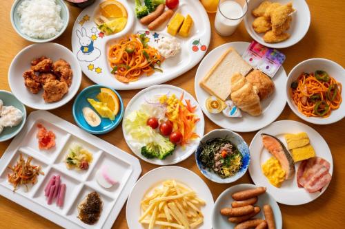 a table with many plates of food on it at Kaikyo View SHIMONOSEKI - Vacation STAY 13687v in Shimonoseki