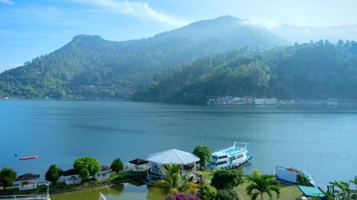 a view of a lake with mountains in the background at Khas Parapat in Parapat