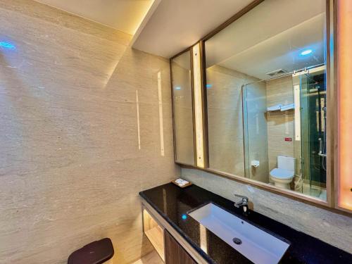 a bathroom with a sink and a mirror at Cahaya Villa Garut in Garut