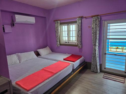 Postel nebo postele na pokoji v ubytování Wen Zhong Hostel