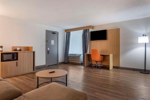 a living room with a couch and a table at Comfort Inn & Suites Nashville Downtown - Stadium in Nashville
