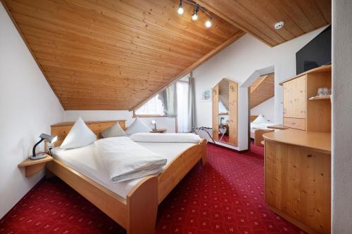 Uma cama ou camas num quarto em Hotel Unterrain