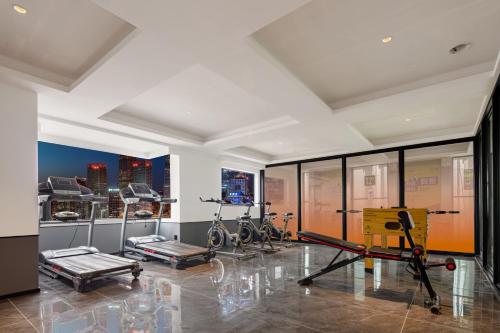 a gym with bikes in a room with windows at Mcsrh Hotel-Chengdu Hongpailou in Chengdu