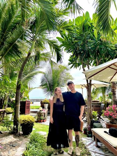 a man and a woman standing next to each other at Sầm Sơn Boutique Hotel Phan Thiết in Phan Thiet