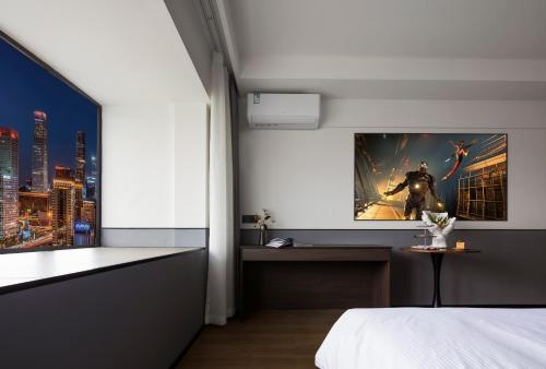 a bedroom with a poster of a superhero on the wall at Mcsrh Hotel-Chengdu Hongpailou in Chengdu