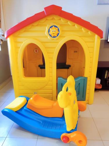 a toy dog house with a toy duck in it at Le'Coco Homestay in Tiara Desaru Residence in Desaru