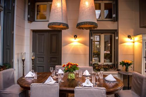 a dining room with a table and chairs at Marpessa Hotel & Spa in Agrinion