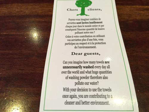 a white card with a tree on top of a table at Metropol Hotel in Calais