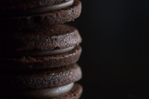 a close up of a stack of chocolate cookies at 時地人 jijijin MATSUYAMA in Tobe