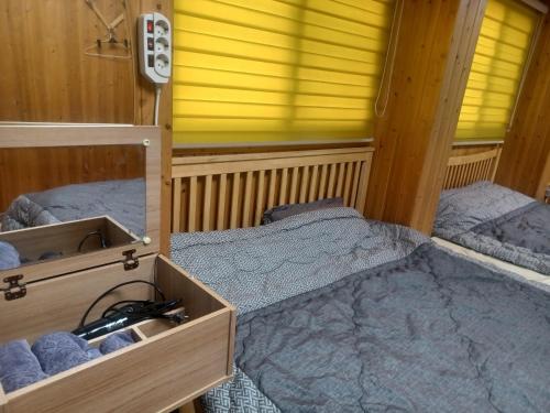 a small room with two beds in it at Vernia in Yeosu