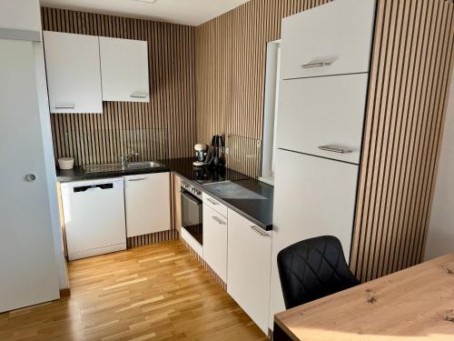 Kuchyň nebo kuchyňský kout v ubytování Goldeck View Apartment